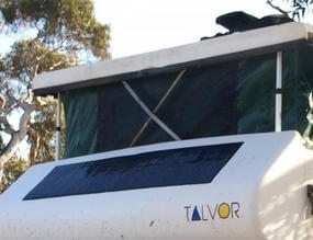Black flexible solar panel on the front of a motorhome