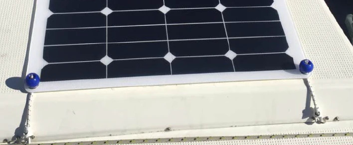 Solar panel with eyelets installed onto canvas